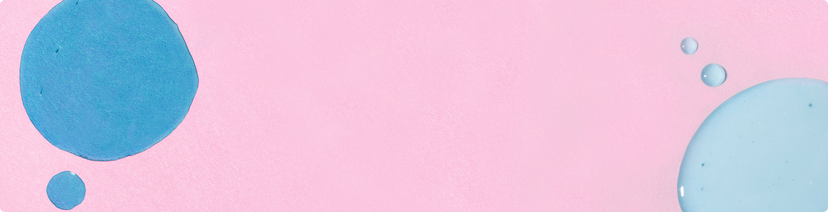 Pink textured banner featuring abstract blue fluid circles
and small droplets on the sides​