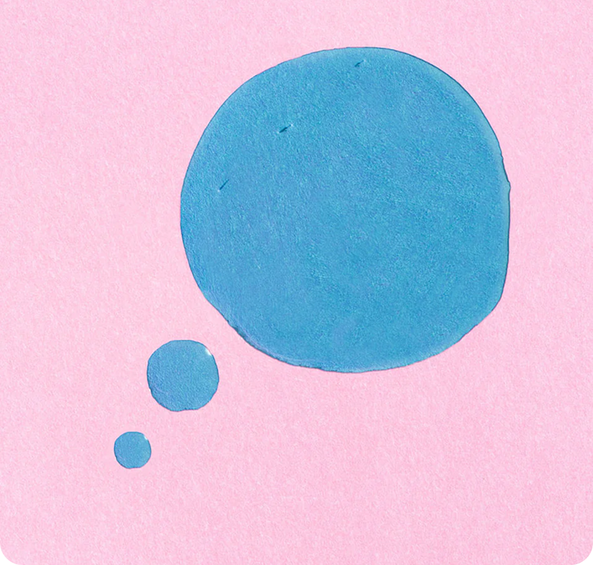 Close-up of blue liquid droplets on a soft
pink background.​