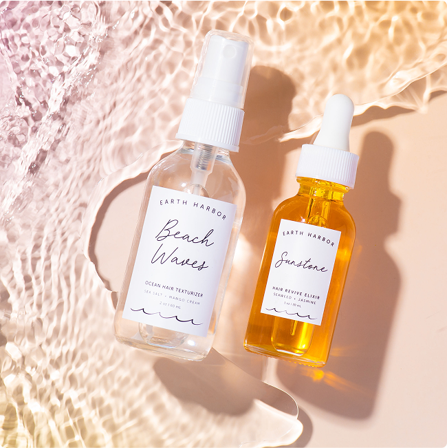 Two skincare bottles displayed in shallow
water with light reflections.​