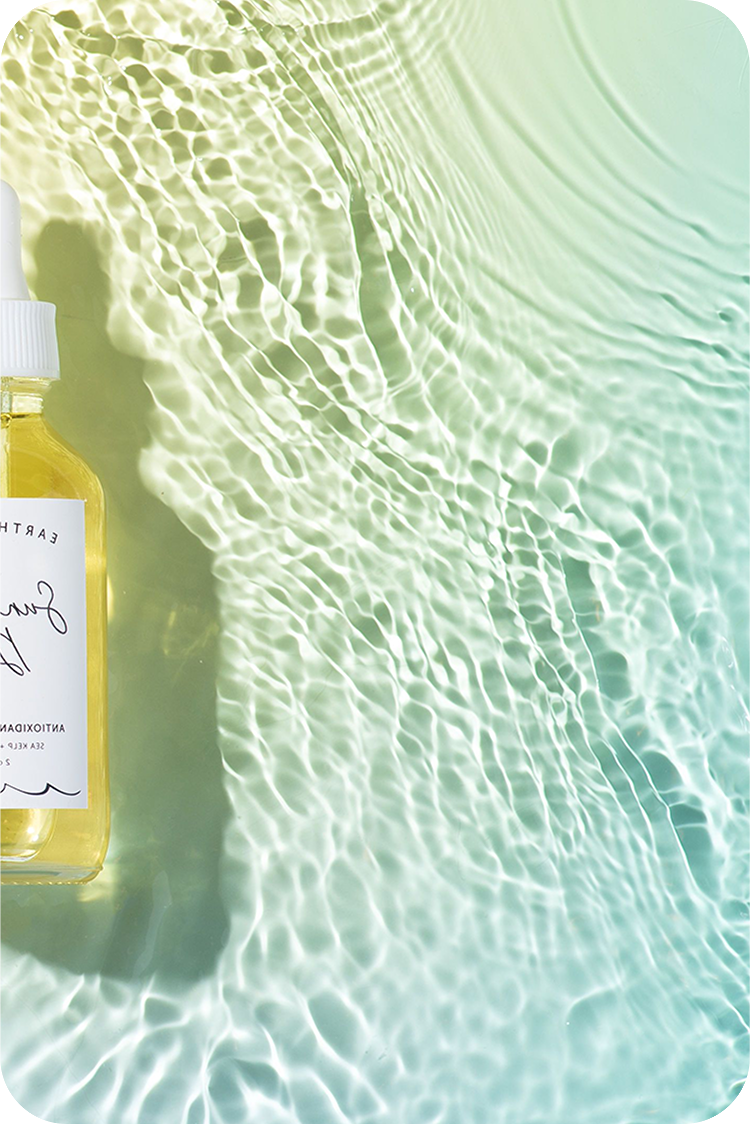Skincare bottle partially visible in rippling
water with light reflections​