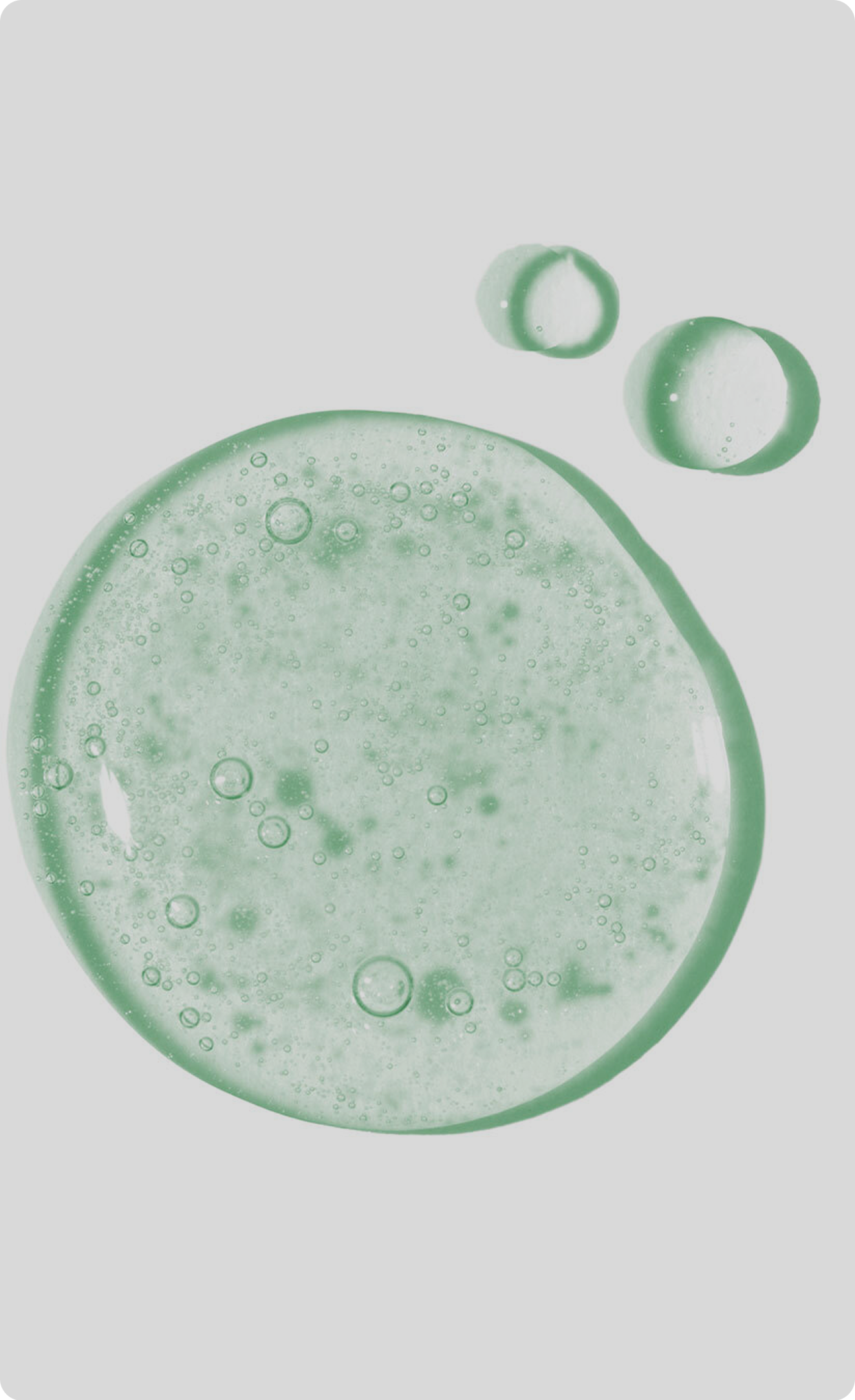 Close-up of green gel cleanser with
bubbles on a light background.​
