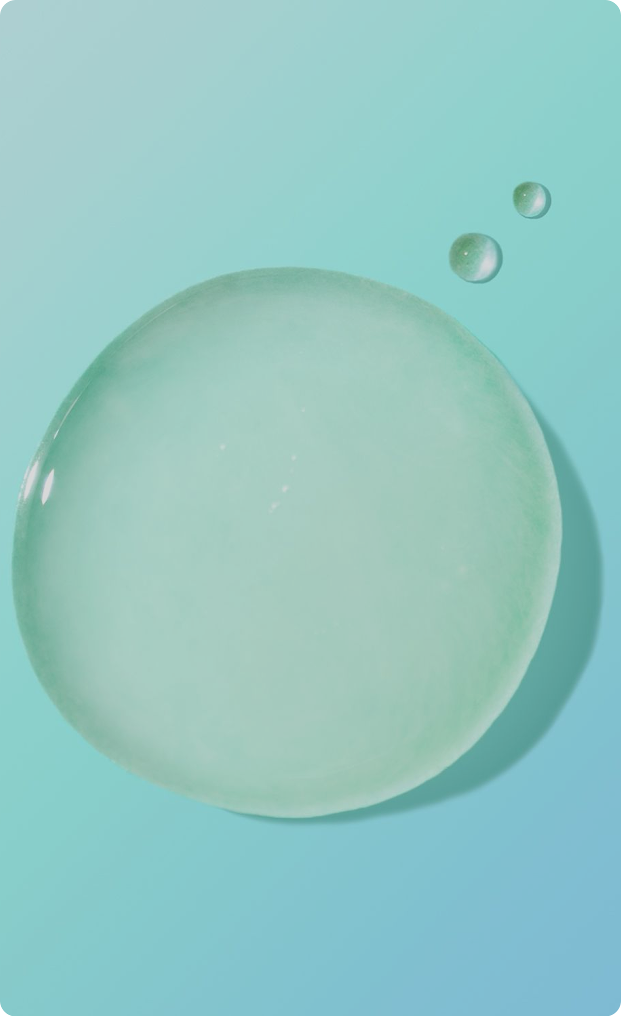 Close-up of a clear green gel droplet with
small bubbles on a blue background.​