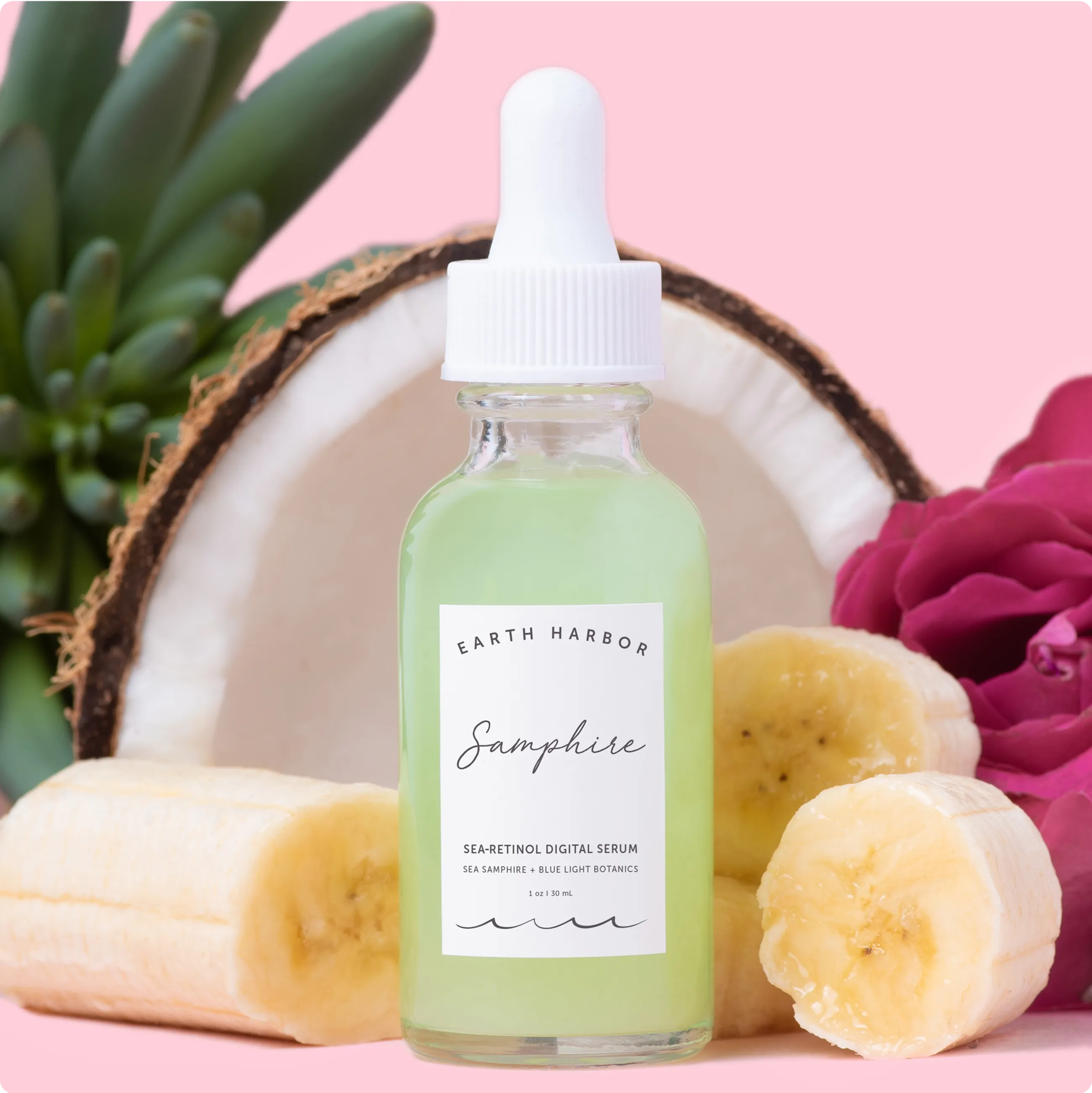 Earth Harbor Samphire serum bottle on a
light blue surface surrounded by white
seashells.​