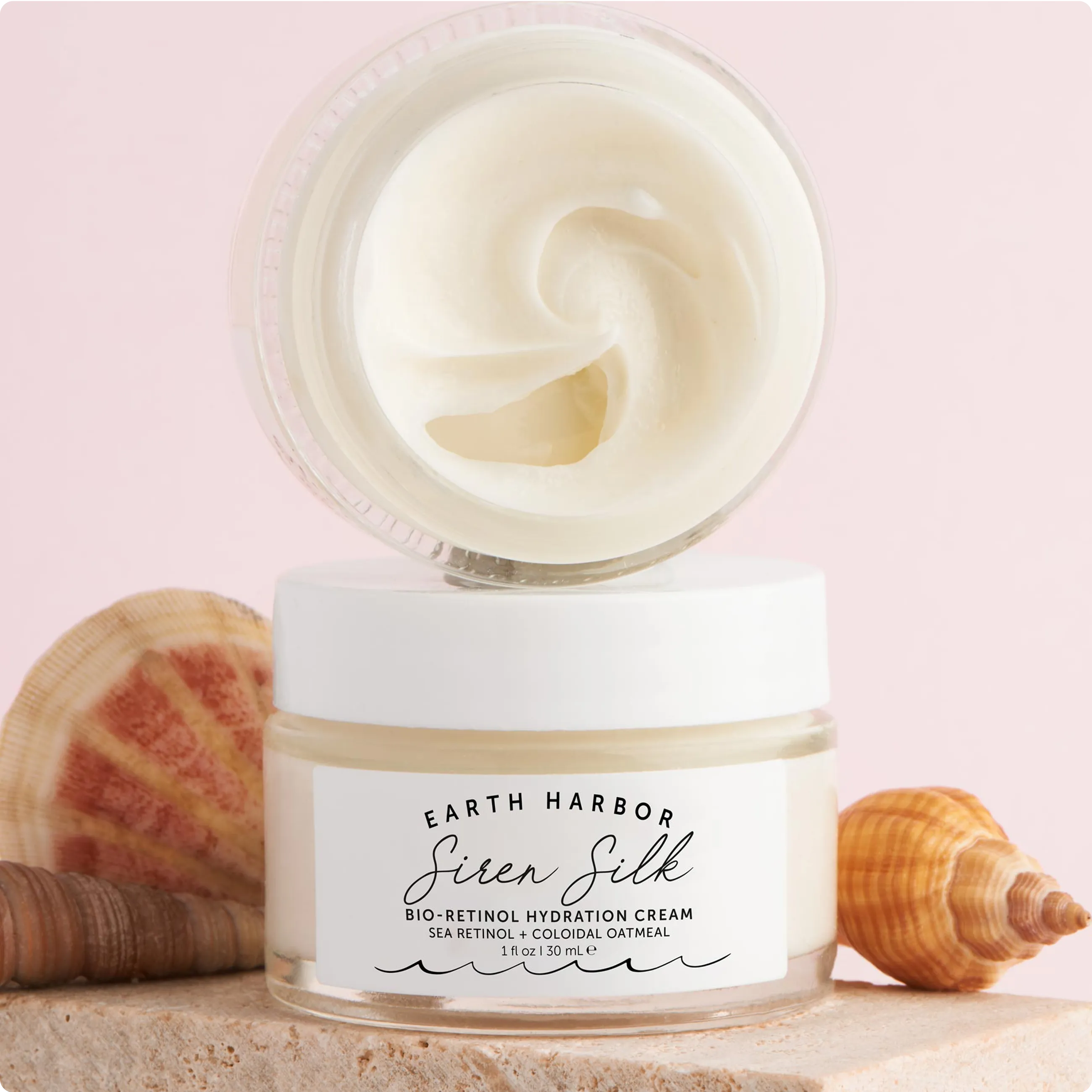 Close-up of an open jar of Earth Harbor
Siren Silk Bio-Retinol Hydration Cream
showing its smooth texture.​